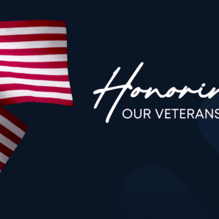 Three small American flags on a blue background with the Texas Children's logo. Text reads "Honoring Our Veterans."